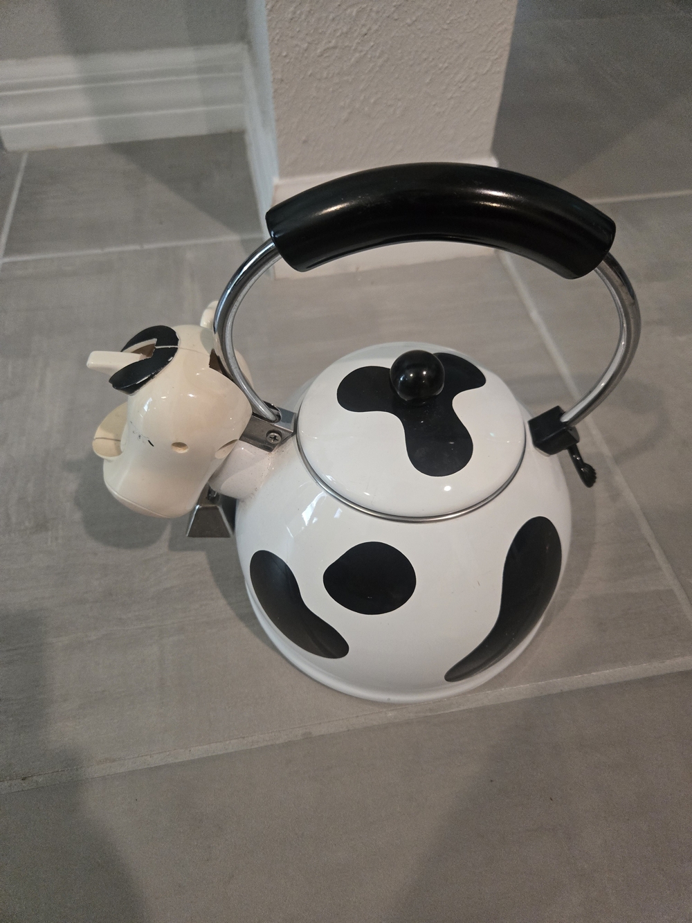 vintage M. Kamenstein black-and-white cow whistling tea kettle